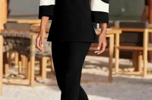 Competo elegante top con maniche a campana e pantaloni, nero