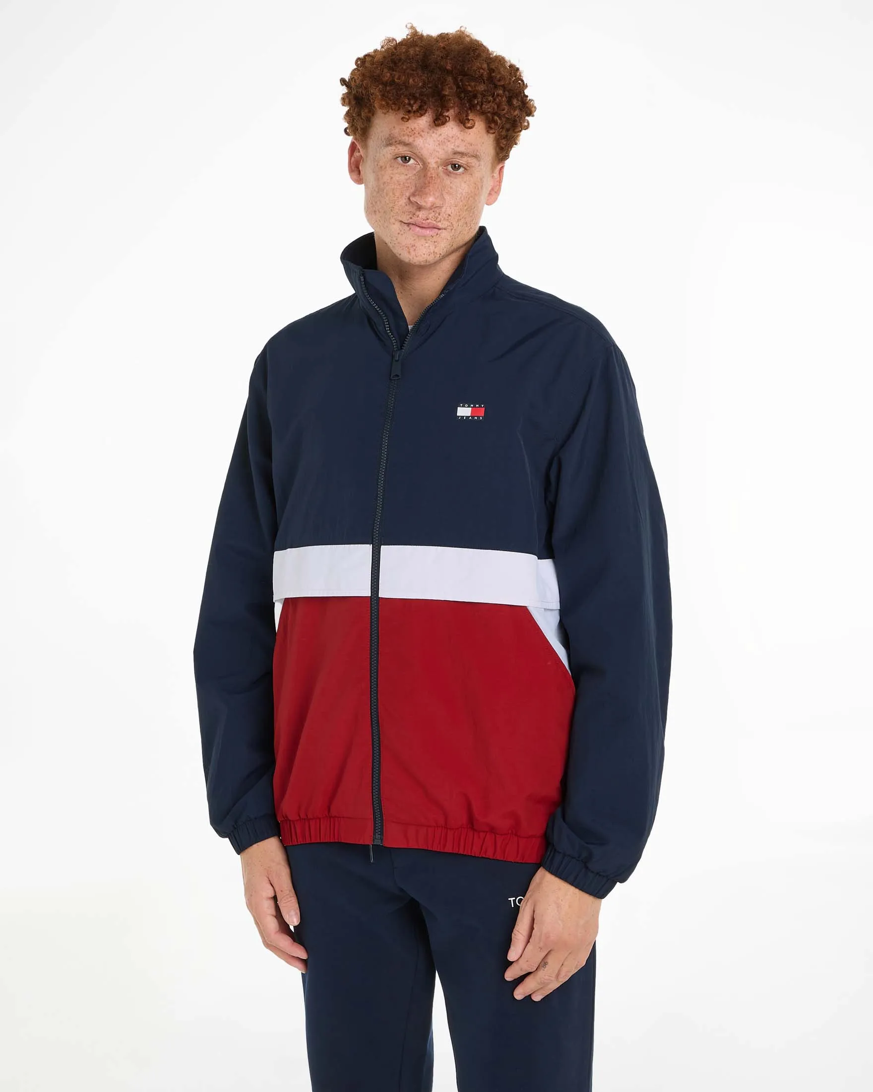 Giubbino antivento color block blu bianco e rosso