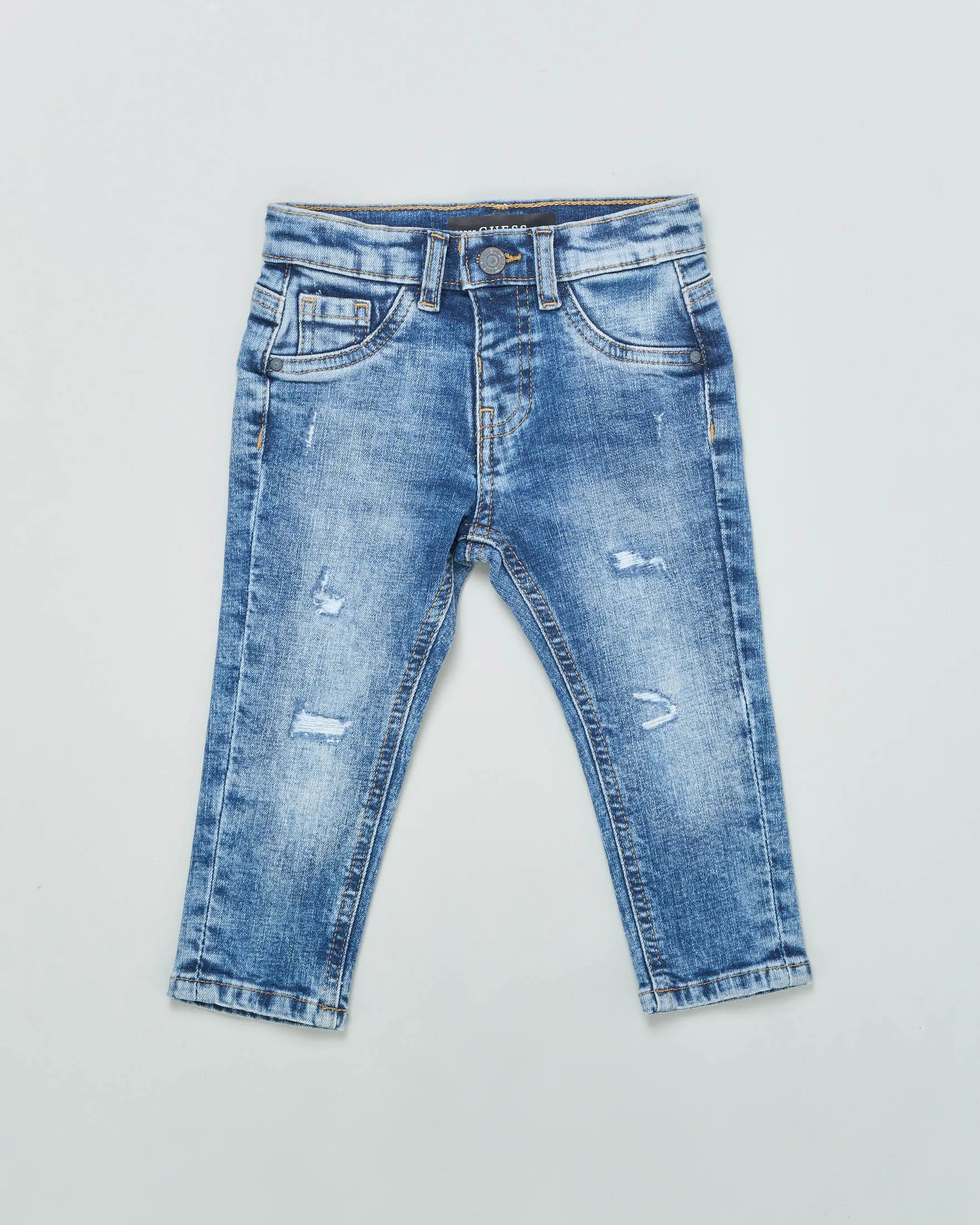 Jeans slim in cotone a lavaggio medio stone washed con abrasioni e micro rotture 12-24 mesi