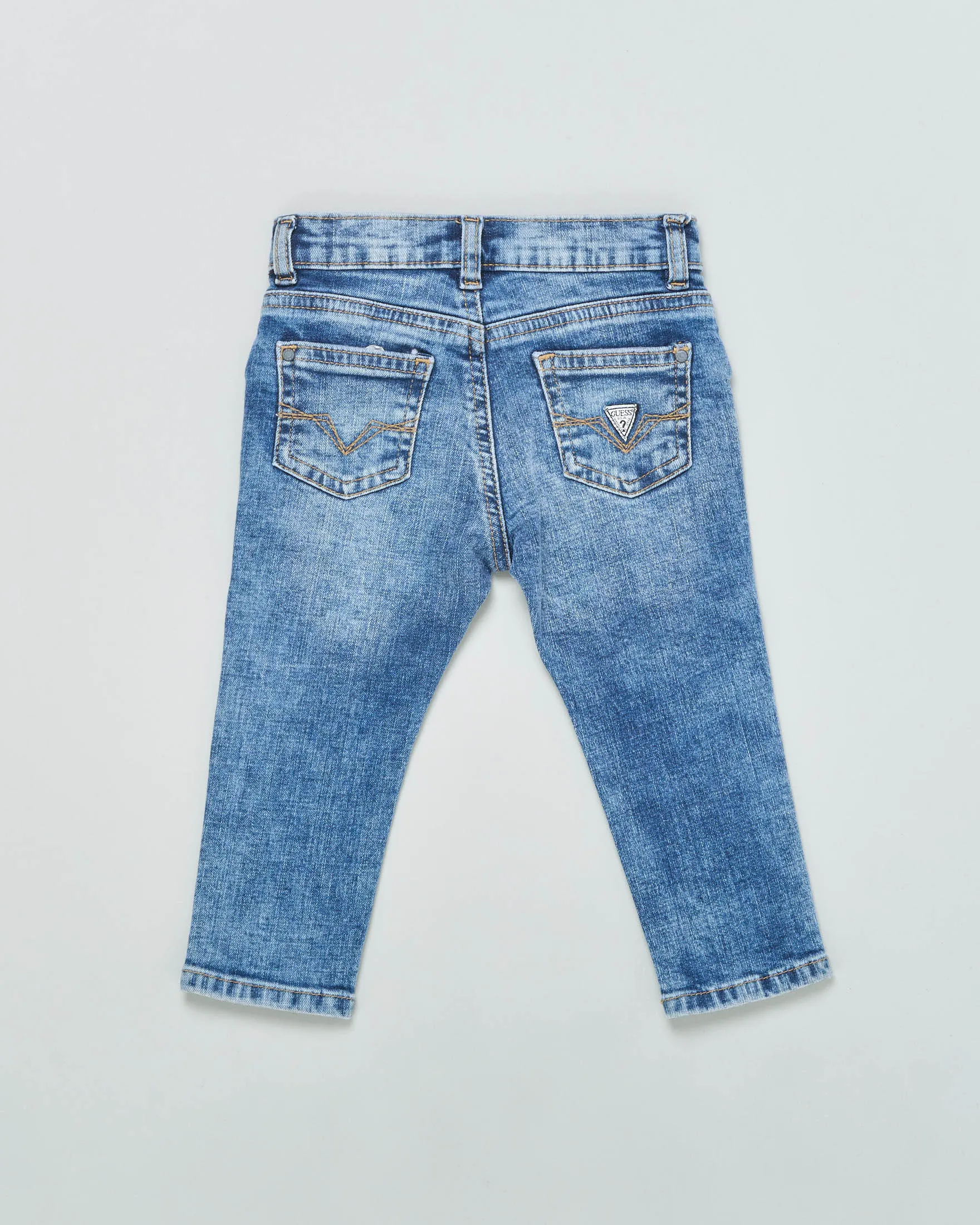 Jeans slim in cotone a lavaggio medio stone washed con abrasioni e micro rotture 12-24 mesi