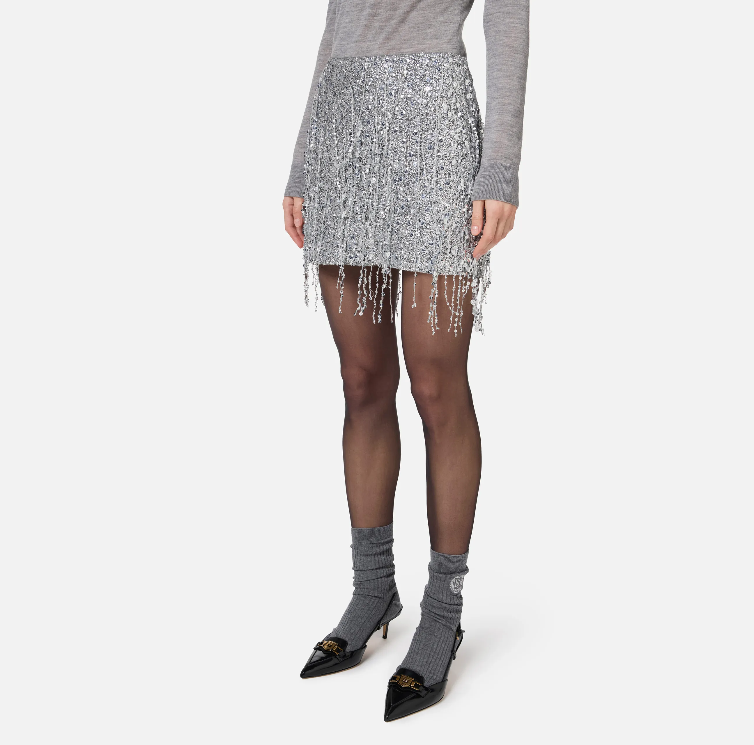 Minigonna in tulle ricamata con frange di paillettes