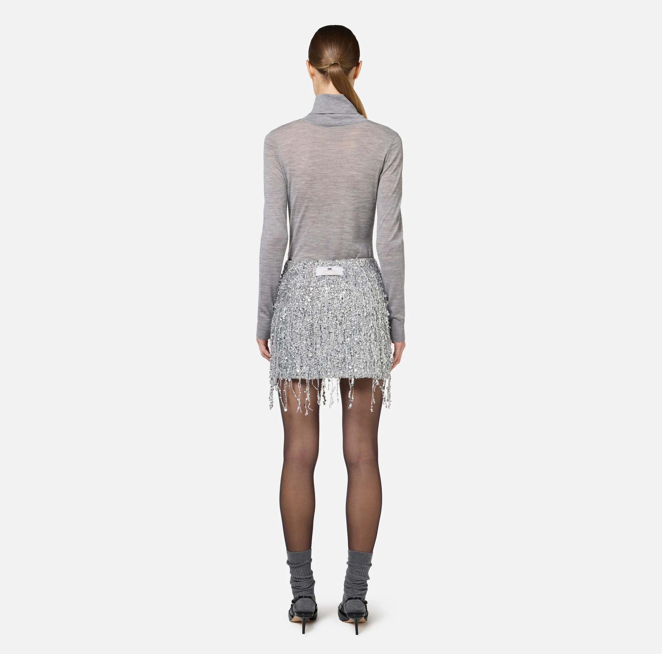 Minigonna in tulle ricamata con frange di paillettes